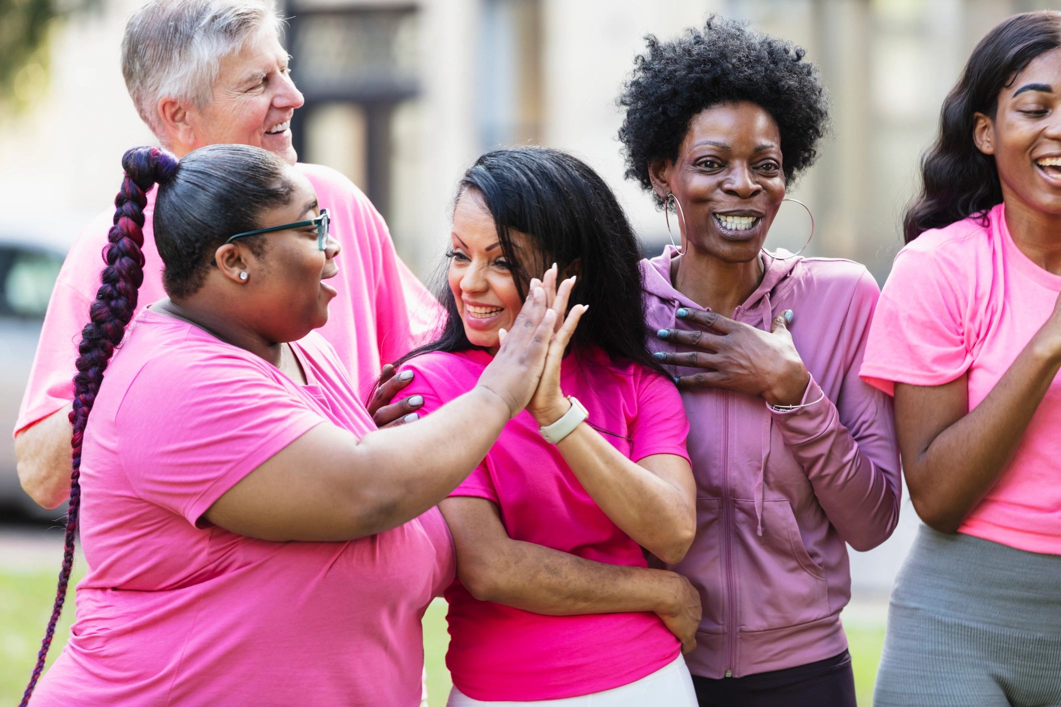 Group wearing pink at a breast cancer awareness event