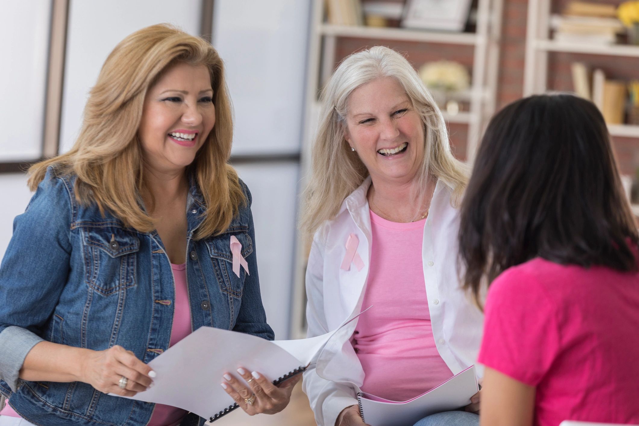 Group of breast cancer survivors and supporters meeting together